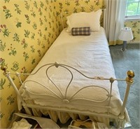 Antique twin size iron bed with bed linens