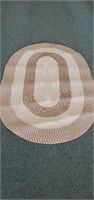 Large brown oval area rug, 55 x 84