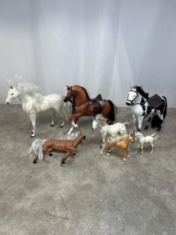 Assortment of plastic toy horses