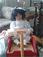 BLACK AMERICANA PORCELAIN DOLL IN WAGON