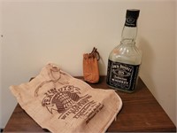 Jack Daniels Bottle, Leather pouch, and burlap sak