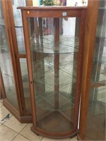 Lighted Corner curio cabinet w/curved glass