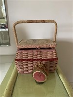 SEWING BASKET WITH SEWING WHATNOTS AND ORNATE PIN