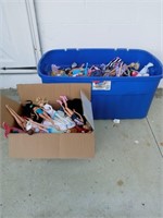 2 tubs of Barbies and accessories