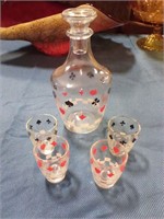 Decanter with shot glasses playing cards