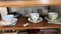 Shelf lot of tea cups and saucers