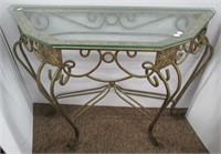 Table with glass top. Measures: 28"Hx36-1/2"W.