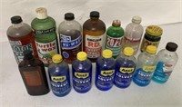 14 mostly automotive products in glass bottles