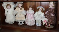 4 Porcelain Dolls & 1 Plastic Doll