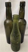 Lot of 3 vintage green glass bottles