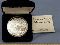 1 ounce .999 silver coin with a seal of State of A