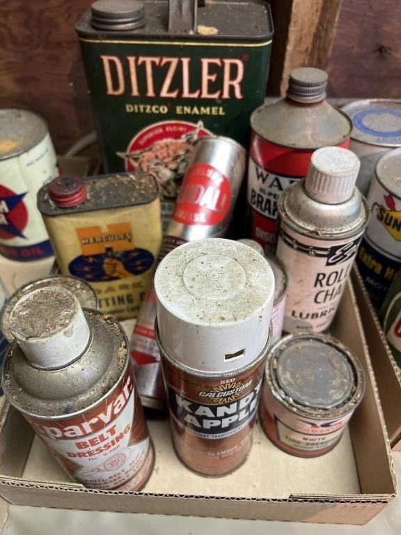 Assorted vintage advertising cans