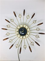 sunburst metal electric clock with wood detail