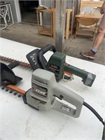 Two electric hedge trimmers