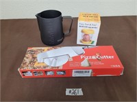 Pizza cutter, egg peeler, measuring cup