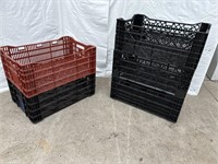 4 black and 1 red stacking crates