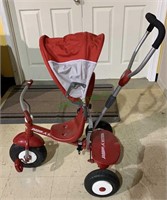 Radio flyer tricycle with a sun hood, a back