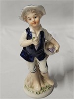 DELFT BLUE BOY WITH GOLD TRIMMING HOLDING FRUIT