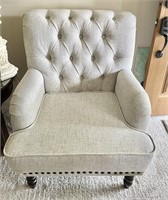 Oversized button-tufted armchair