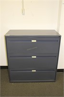 Grey three drawer metal file cabinet