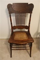 Cane seat carved oak spindle back chair