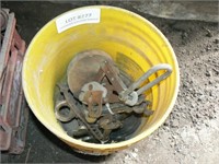 Plastic bucket with wrenches, pulleys, sheet