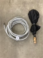 Garden hose and umbrella (under the table)