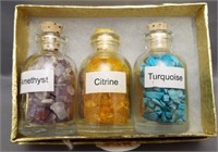 (3) Small glass bottles containing amethyst,