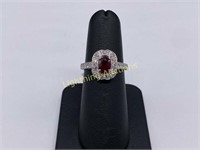 PLATINUM OVAL CUT RUBY AND DIAMOND HALO RING
