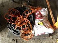 Pallet lot with extension cords and oil dry