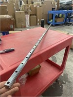 New 67 inch drilled and slotted steel bar. Unsure