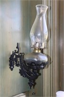 Wall mounted oil lamp with cast iron holder and