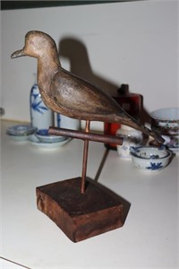 Dove decoy mounted on wooden base