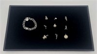 7.5” Sterling Charm Bracelet With 9 Assorted