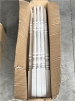 Box of white wood balusters