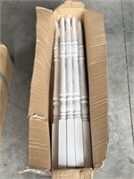 Box of white wood balusters