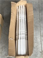 Box of white wood balusters
