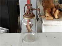glass butter churn with top marked Dazey