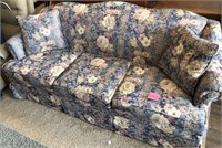 Floral couch with 2 throw pillows