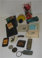 Vintage items including toy cars, various pins,