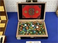 CROWNED HEADS COURT CIGAR BOX FILLED W/ MARBLES
