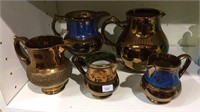 Group of 5 antique copper luster jugs, 2 with