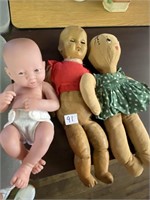 Two baby dolls, and a ragdoll