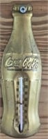 Small gold color metal Coca-Cola thermometer