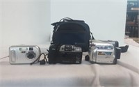 2 traditional digital cameras and a video camera