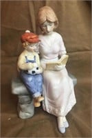 Woman and Child Reading Book Figurine