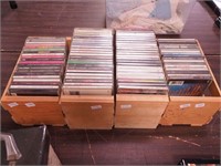 Four wooden boxes of music CDs