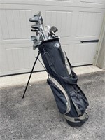 Golf Bag with Various Clubs and Accessories