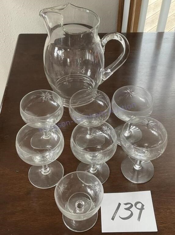 Seven Crystal Champagne Glasses and Water Pitcher