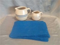 2 PC. Ceramic pitchers and 5 blue placemats